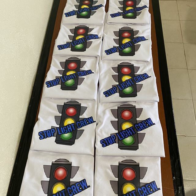 Rows of printed white t-shirts